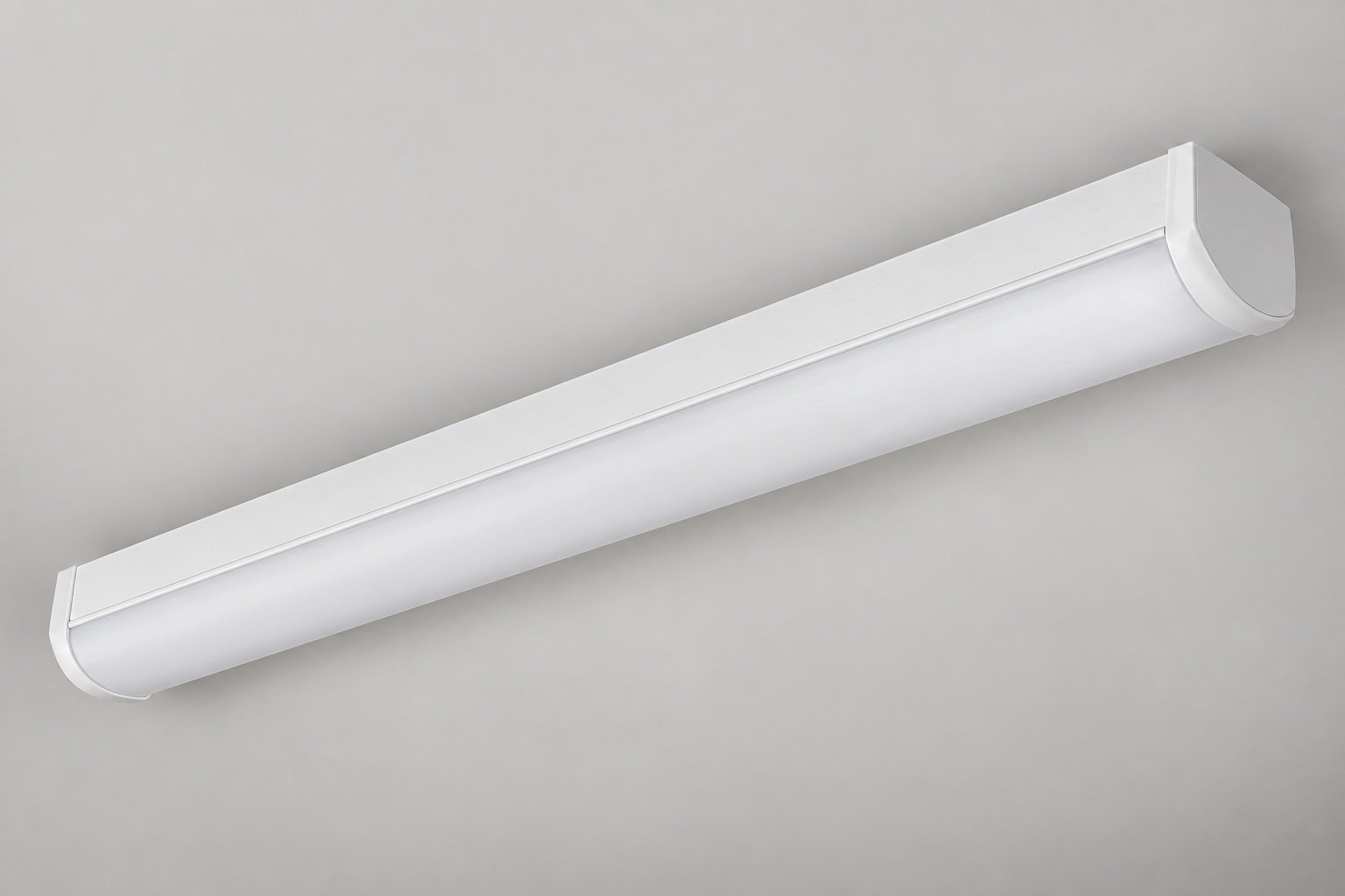 Illustrative North American commercial linear LED strip luminaire with an opal diffuser.