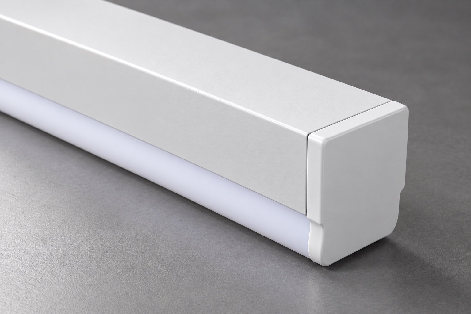 Illustrative close-up of a linear luminaire housing and end-cap seam.