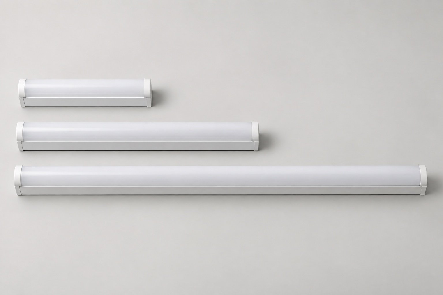 Illustrative commercial strip luminaire family in three lengths.