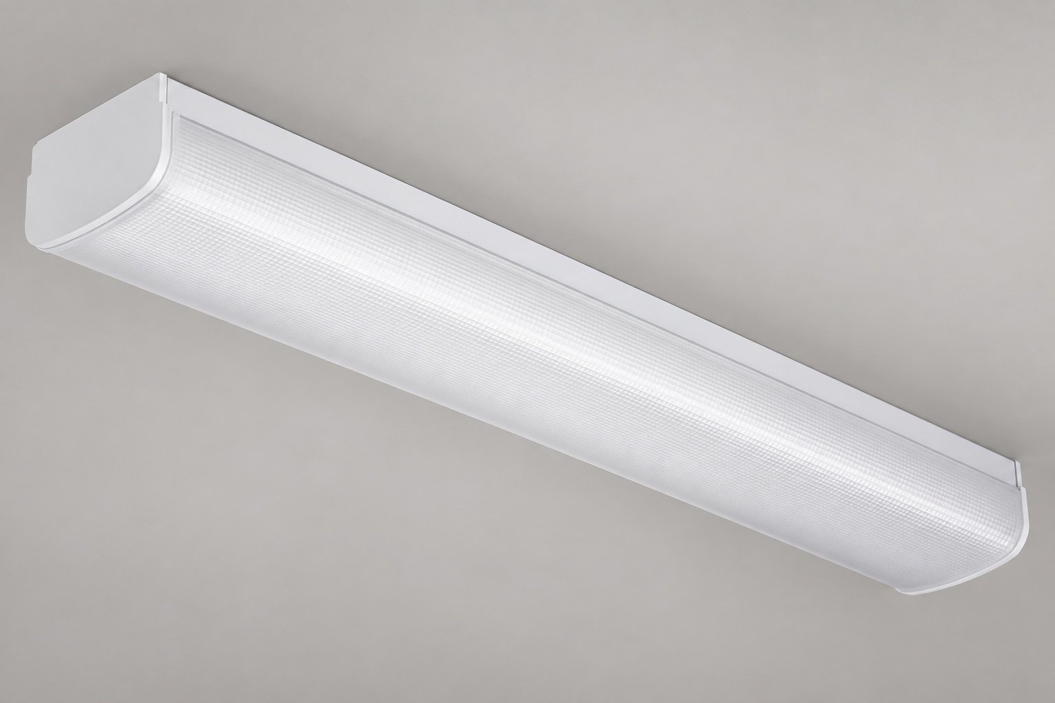 Illustrative commercial LED wraparound luminaire with a prismatic diffuser.