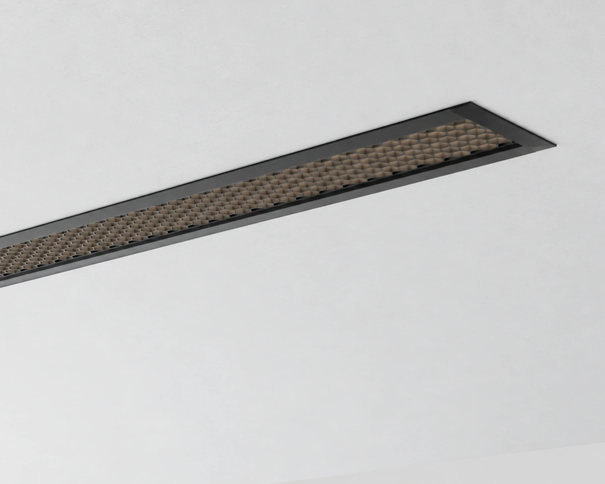 AM Series recessed linear light with a black louver optic in a ceiling